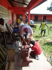 Kev Kelly helps put together a bench