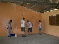 Cadets painting the wall inside the school in Ghana