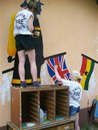 Cadets finish painting a mural